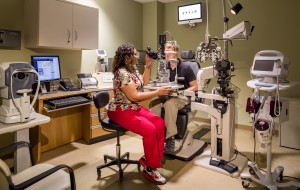 A veteran receiving one of the new available sevices - an eye exam.